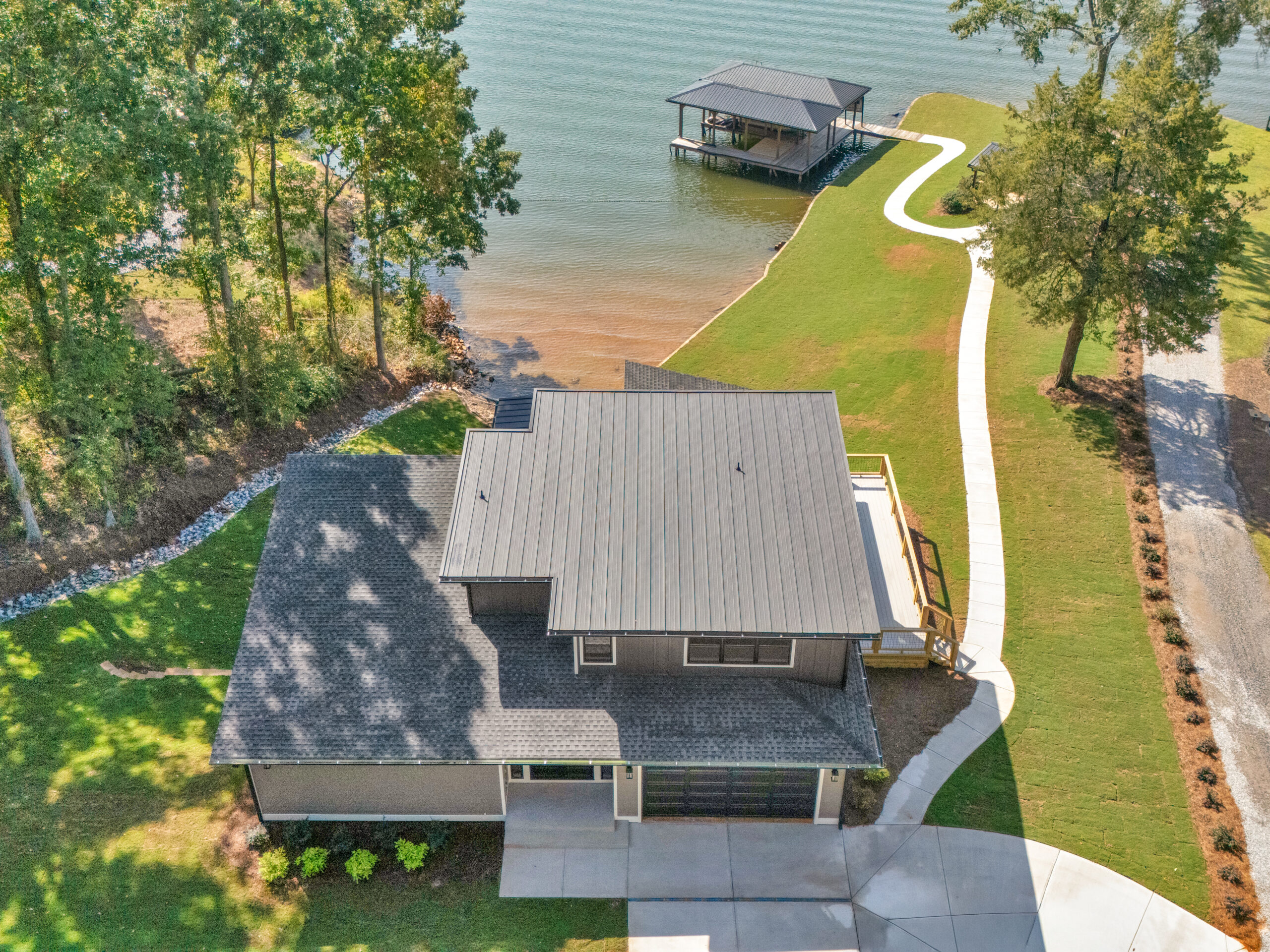 Coordinated trade crews framing a custom lake house on schedule near Monticello, GA