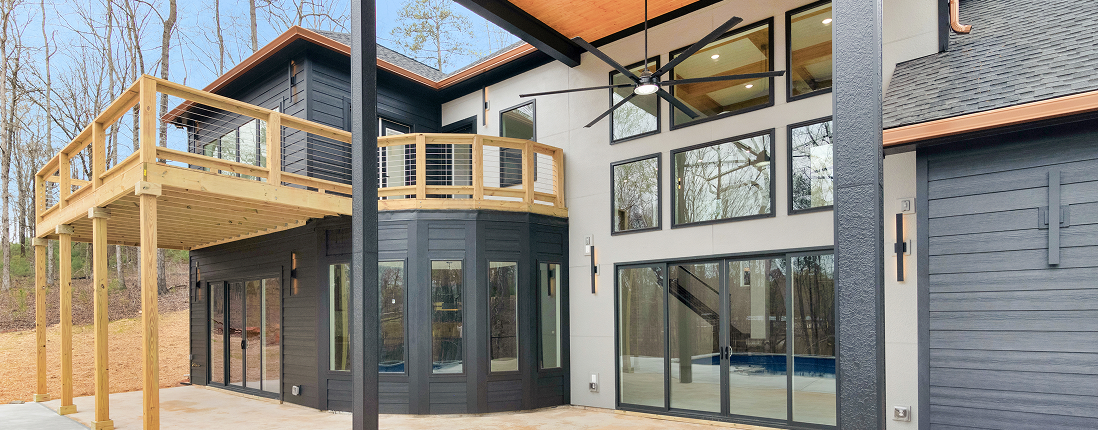 Barndominium exterior with covered deck